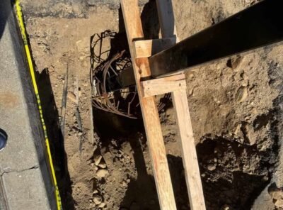 Construction site with wooden supports and excavation